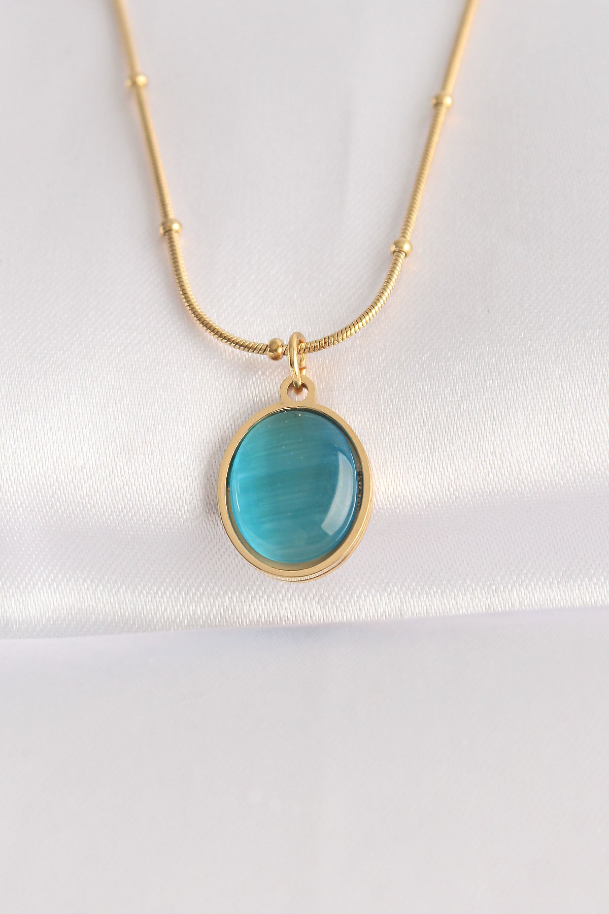 Halskette aus 316L-Stahl, Goldfarbe, blaue Perle, ovale Figur
